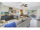Stylish living room with neutral furniture, eclectic decor, and a seamless flow to the outdoor patio at 11376 119Th Ter, Largo, FL 33778
