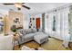 Bright living room featuring cozy sofa, eclectic décor, and lots of natural light at 11376 119Th Ter, Largo, FL 33778