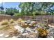 Backyard patio showing a great outdoor sitting area on a paved patio with garden space, bordered by a wood fence at 11376 119Th Ter, Largo, FL 33778