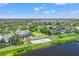 Beautiful aerial view of community with beach, lake access, and manicured landscaping at 11742 Lake Lucaya Dr, Riverview, FL 33579