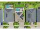 Aerial view of rooftops with solar panels and backyard pools at 11742 Lake Lucaya Dr, Riverview, FL 33579