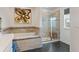 Bathroom with a soaking tub, walk-in shower, and tiled accents at 11742 Lake Lucaya Dr, Riverview, FL 33579