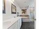 Bathroom featuring a dual sink vanity, soaking tub, and walk-in shower at 11742 Lake Lucaya Dr, Riverview, FL 33579