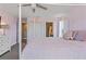 Bedroom featuring a four-poster bed and ensuite bath at 11742 Lake Lucaya Dr, Riverview, FL 33579
