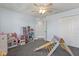 Bright bedroom featuring playful furniture and carpet floors at 11742 Lake Lucaya Dr, Riverview, FL 33579