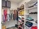 Walk-in closet with ample shelving, racks, and luggage storage at 11742 Lake Lucaya Dr, Riverview, FL 33579