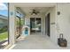 Covered patio area overlooking the screened-in pool, offering comfortable outdoor living space at 11742 Lake Lucaya Dr, Riverview, FL 33579