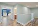 Hallway with wood floors that connects to a main bedroom and bathroom at 11742 Lake Lucaya Dr, Riverview, FL 33579