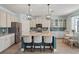 Beautiful kitchen features an island with seating, stainless steel appliances, and plenty of cabinet space at 11742 Lake Lucaya Dr, Riverview, FL 33579