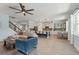 Bright, open-concept living space connecting kitchen, dining, and lounge areas, showcasing the home's layout at 11742 Lake Lucaya Dr, Riverview, FL 33579