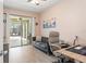 Comfortable living room leading to a screened patio with pool views at 11742 Lake Lucaya Dr, Riverview, FL 33579