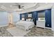 A spacious bedroom features an accent wall, trey ceiling, and wood-look floors, offering comfort and style at 11742 Lake Lucaya Dr, Riverview, FL 33579