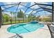 Beautiful pool with an adjacent spa area and screened enclosure at 11742 Lake Lucaya Dr, Riverview, FL 33579