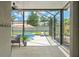 Screened-in lanai featuring a pool, spa, lounge chairs, and comfortable outdoor seating area at 11742 Lake Lucaya Dr, Riverview, FL 33579