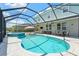 A beautiful screened-in pool and hot tub with outdoor seating and a view of the surrounding area at 11742 Lake Lucaya Dr, Riverview, FL 33579