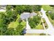 Aerial view of a home with a defined property line, showcasing the lot's size and location at 12435 Oak St, San Antonio, FL 33576