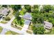 Aerial view of home with a defined property line, showing mature trees and landscaping at 12435 Oak St, San Antonio, FL 33576