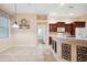 Dining room with tile flooring and view into the kitchen at 12435 Oak St, San Antonio, FL 33576