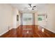 Inviting living room with hardwood floors, natural light, and neutral walls at 12435 Oak St, San Antonio, FL 33576