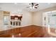 Open-concept living area featuring hardwood floors and a view of the kitchen at 12435 Oak St, San Antonio, FL 33576