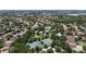Expansive aerial view of community amenities including lakes, tennis courts, basketball courts and green spaces at 12443 Adventure Dr, Riverview, FL 33579