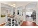 Bright dining area featuring wood floors and open arches leading to other living spaces at 12443 Adventure Dr, Riverview, FL 33579