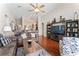 Open-concept living room with hardwood floors, comfortable seating, and entertainment center at 12443 Adventure Dr, Riverview, FL 33579