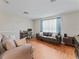 Cozy living room with modern furniture and a window overlooking the backyard at 12443 Adventure Dr, Riverview, FL 33579