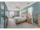 Spacious main bedroom boasts a ceiling fan, sitting area and ensuite bath at 12443 Adventure Dr, Riverview, FL 33579