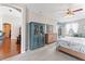This main bedroom is comfortably decorated with a sitting area and ensuite bath at 12443 Adventure Dr, Riverview, FL 33579