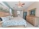Comfortable main bedroom with a ceiling fan, neutral carpet, and ensuite bath access at 12443 Adventure Dr, Riverview, FL 33579