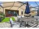 Spacious backyard with a covered patio, stylish seating, and lush greenery provides a relaxing outdoor experience at 12643 Horseshoe Bend Dr, Lithia, FL 33547