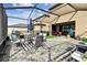 Expansive backyard with outdoor seating, grill, and screened-in patio, ideal for outdoor living and entertaining at 12643 Horseshoe Bend Dr, Lithia, FL 33547
