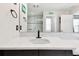 Bathroom with quartz countertops, a sink, a mirror, and neutral colored walls at 12643 Horseshoe Bend Dr, Lithia, FL 33547