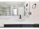 Bright bathroom with quartz countertops, sink, mirror and neutral colored walls at 12643 Horseshoe Bend Dr, Lithia, FL 33547