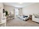 Cozy bedroom features a desk area and lots of natural light at 12643 Horseshoe Bend Dr, Lithia, FL 33547