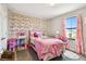 Charming bedroom decorated with pink accents and ample natural light at 12643 Horseshoe Bend Dr, Lithia, FL 33547