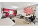 Versatile bonus room enhanced by stylish decor, offering a comfortable seating area and functional workspace at 12643 Horseshoe Bend Dr, Lithia, FL 33547