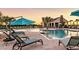 Resort-style community pool features palm trees, lounge chairs, a clubhouse, and a relaxing atmosphere at 12643 Horseshoe Bend Dr, Lithia, FL 33547