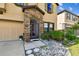 Inviting front entrance featuring stone accents, a colorful screen door, and well-maintained landscaping at 12643 Horseshoe Bend Dr, Lithia, FL 33547