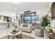 Open living room with access to the outdoor space and view of the dining area at 12643 Horseshoe Bend Dr, Lithia, FL 33547
