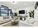 Bright living room featuring comfortable seating, a fireplace, and stylish decor at 12643 Horseshoe Bend Dr, Lithia, FL 33547