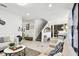 Inviting living room with a staircase and open floor plan at 12643 Horseshoe Bend Dr, Lithia, FL 33547