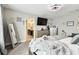 Relaxing main bedroom showcases a king bed, television, ample lighting, and stylish decor at 12643 Horseshoe Bend Dr, Lithia, FL 33547