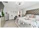 Comfortable main bedroom with luxurious bedding, gray color scheme, and elegant decorative touches at 12643 Horseshoe Bend Dr, Lithia, FL 33547