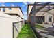 View of side yard between house and fence, showcasing the property's boundary and outdoor space at 12643 Horseshoe Bend Dr, Lithia, FL 33547