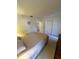 Bedroom with carpeted floor, closet and dresser with an attached mirror at 1332 Fuchsia Dr, Holiday, FL 34691