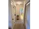 Hallway view leading to a bedroom and bathroom at 1332 Fuchsia Dr, Holiday, FL 34691