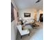 Cozy living room featuring neutral carpet, comfortable seating, and a large window letting in natural light at 1332 Fuchsia Dr, Holiday, FL 34691