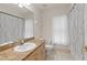 Full bathroom with a single sink vanity and shower/tub combo at 13375 Newcastle Ave, Spring Hill, FL 34609